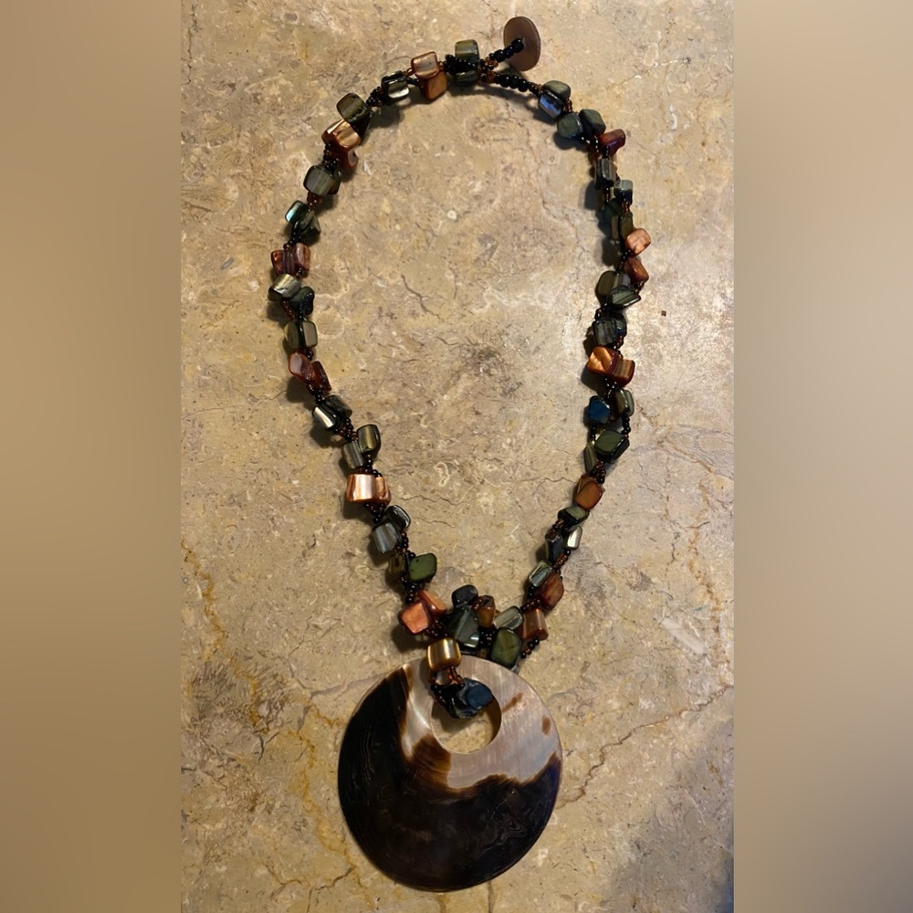 Shell beaded disc necklace.